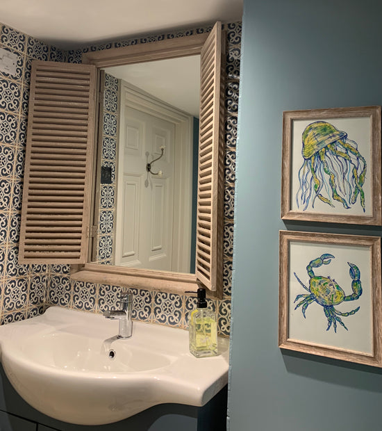 A pair of hand-drawn blue ink crab and jellyfish commissions to go with a newly designed bathroom