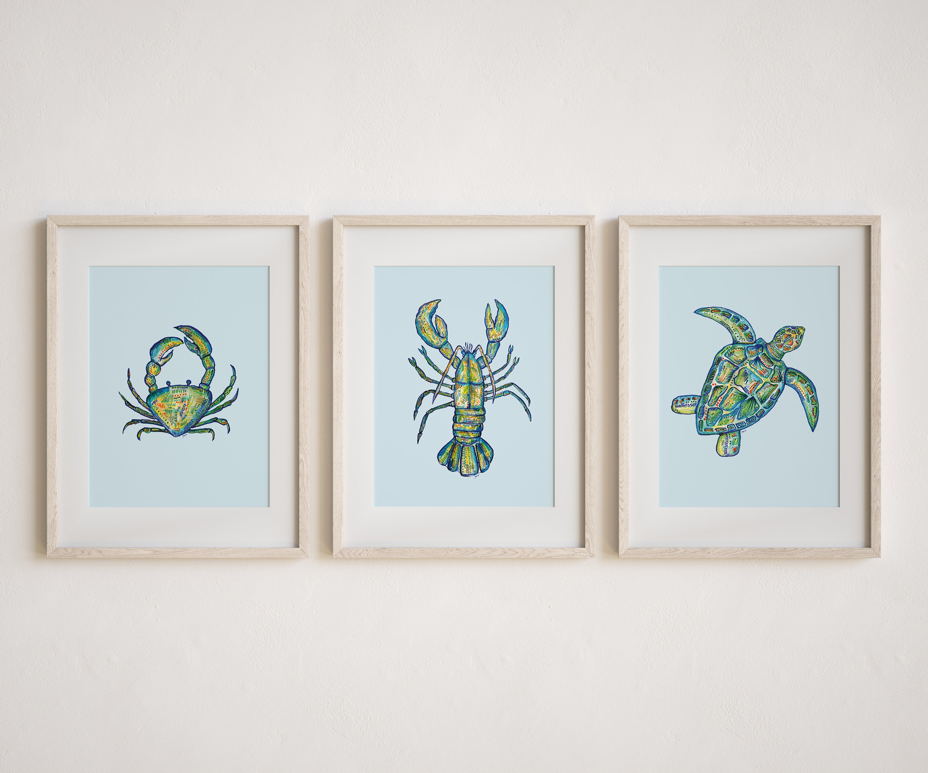 Three blue prints on a wall