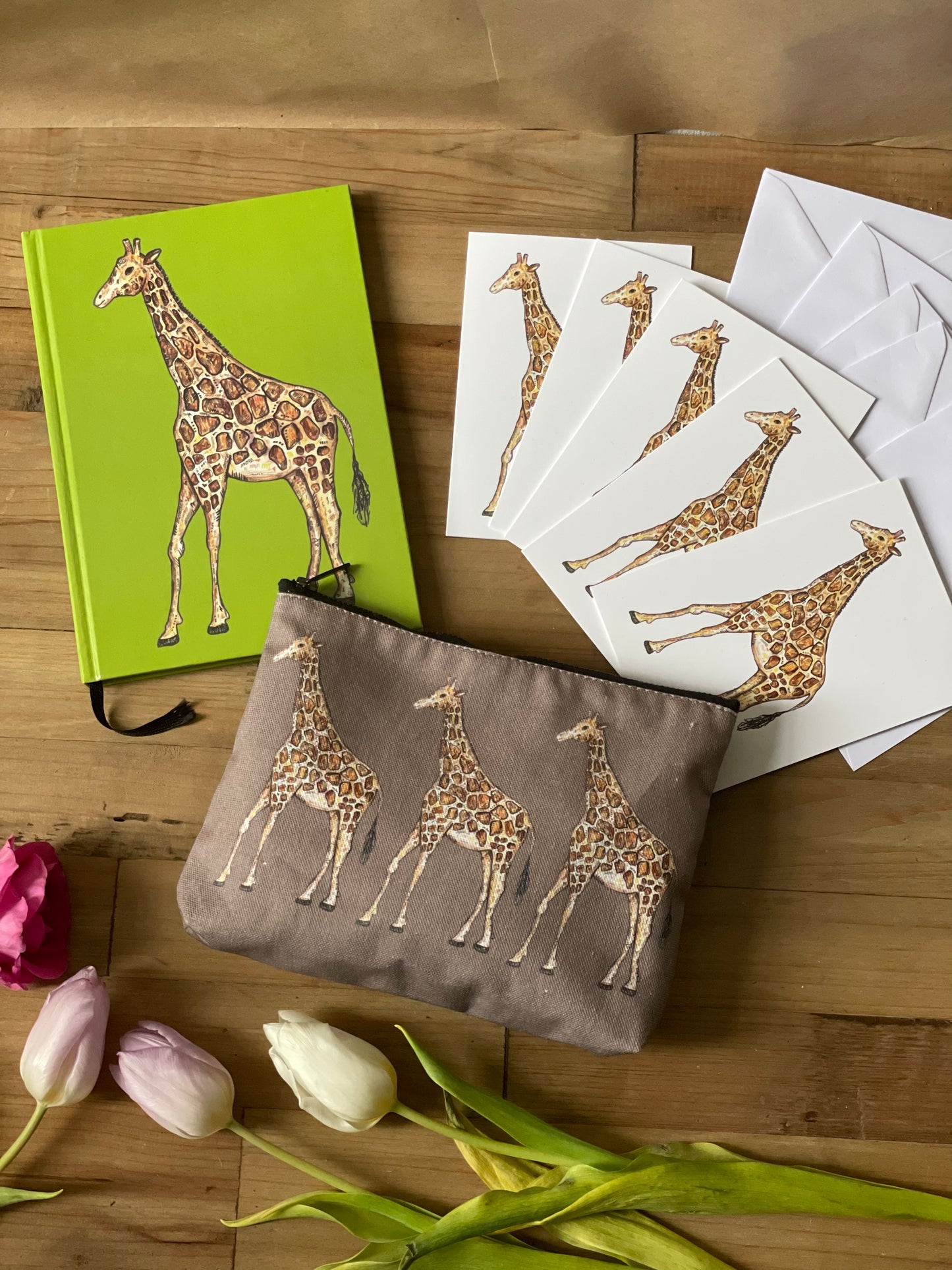 This giraffe gift set includes an A5 giraffe notebook, a 5 x card pack of giraffe cards and a giraffe pouch.