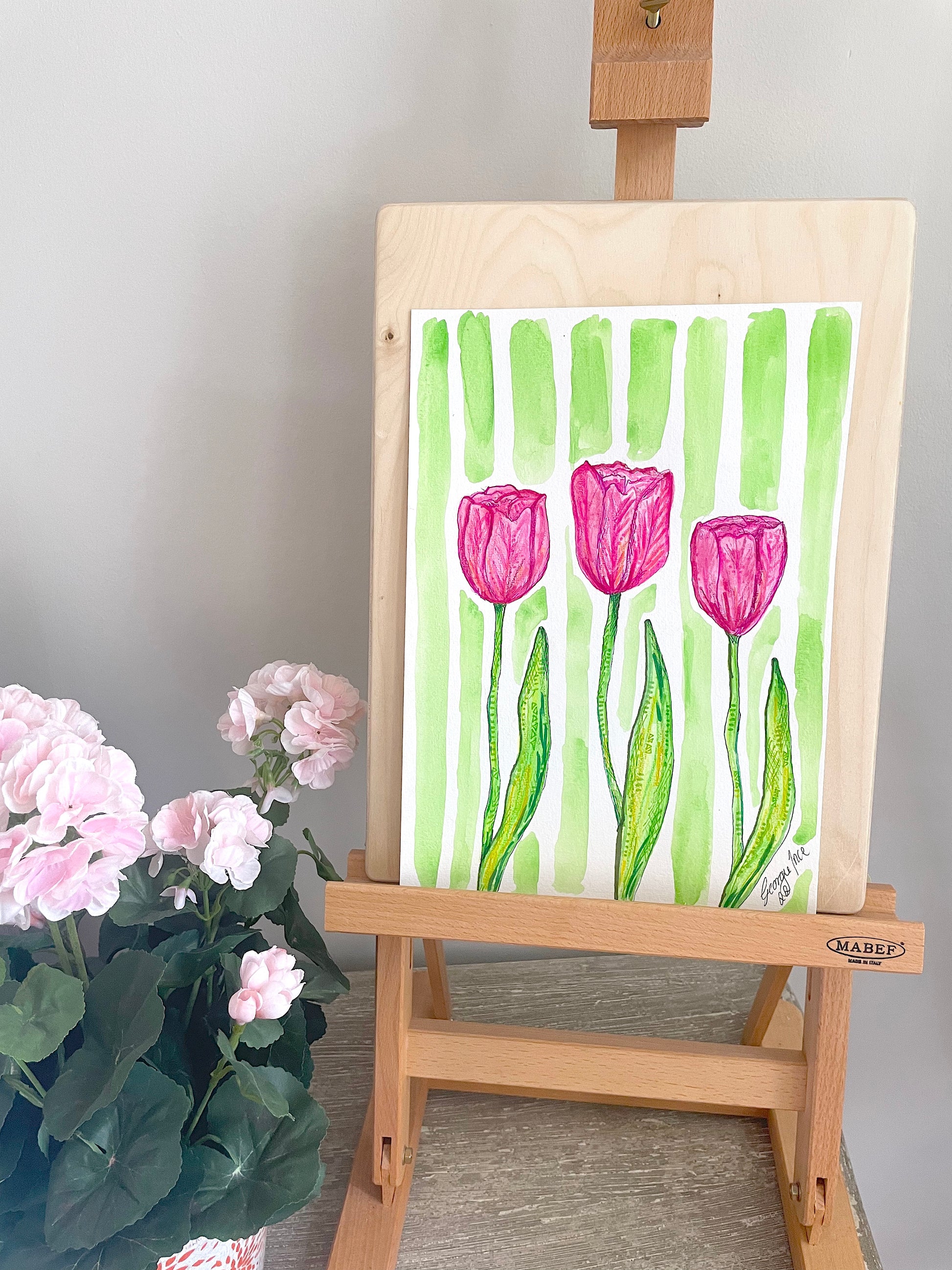 Original watercolour pink tulips with a green stripe background. 