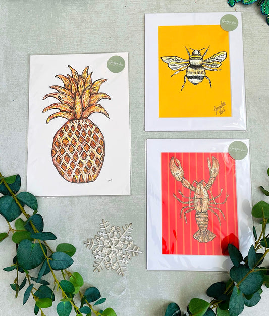 Set of three prints in a bee, lobster and pineapple print