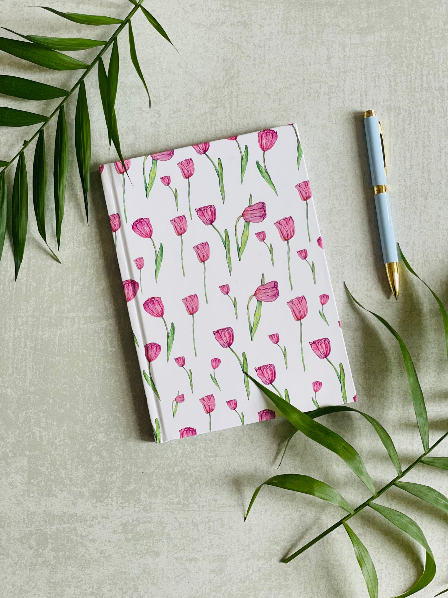 Premium hardback pink tulip notebook designed in the UK