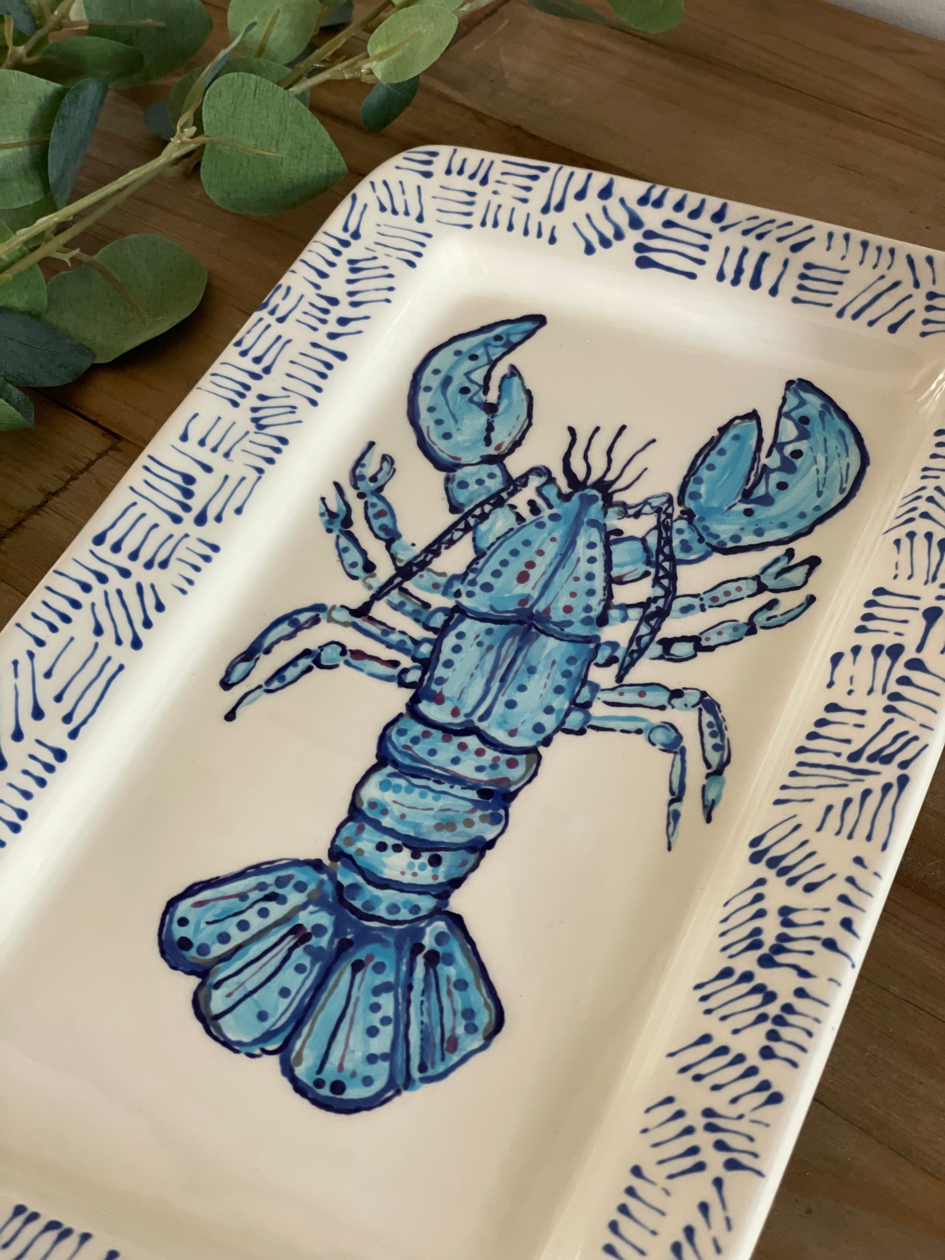 A hand painted blue lobster platter made in the UK. Perfect for outdoor dining this summer!