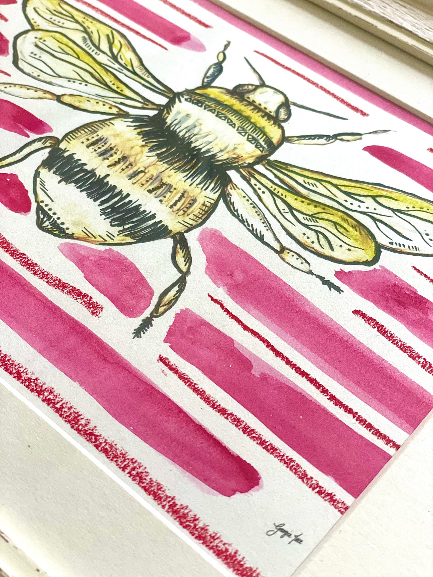 Framed bee print with pink hand painted watercolour pink background